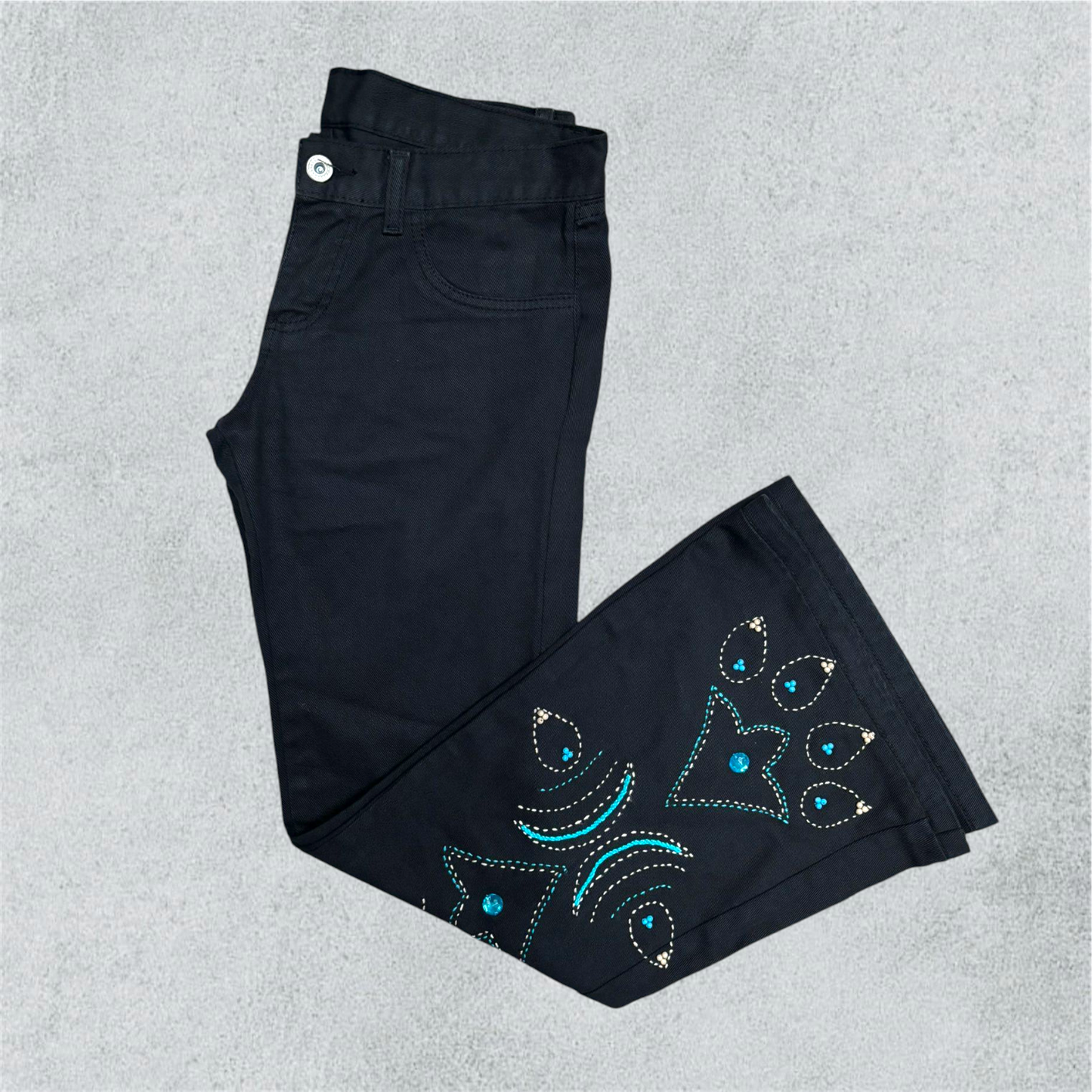 Black Flared Trousers With Embroidered And Beaded Decorations.