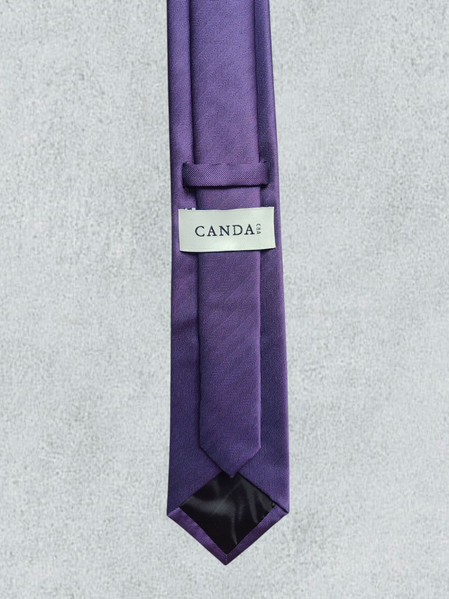 Purple Tie With A Herringbone Pattern