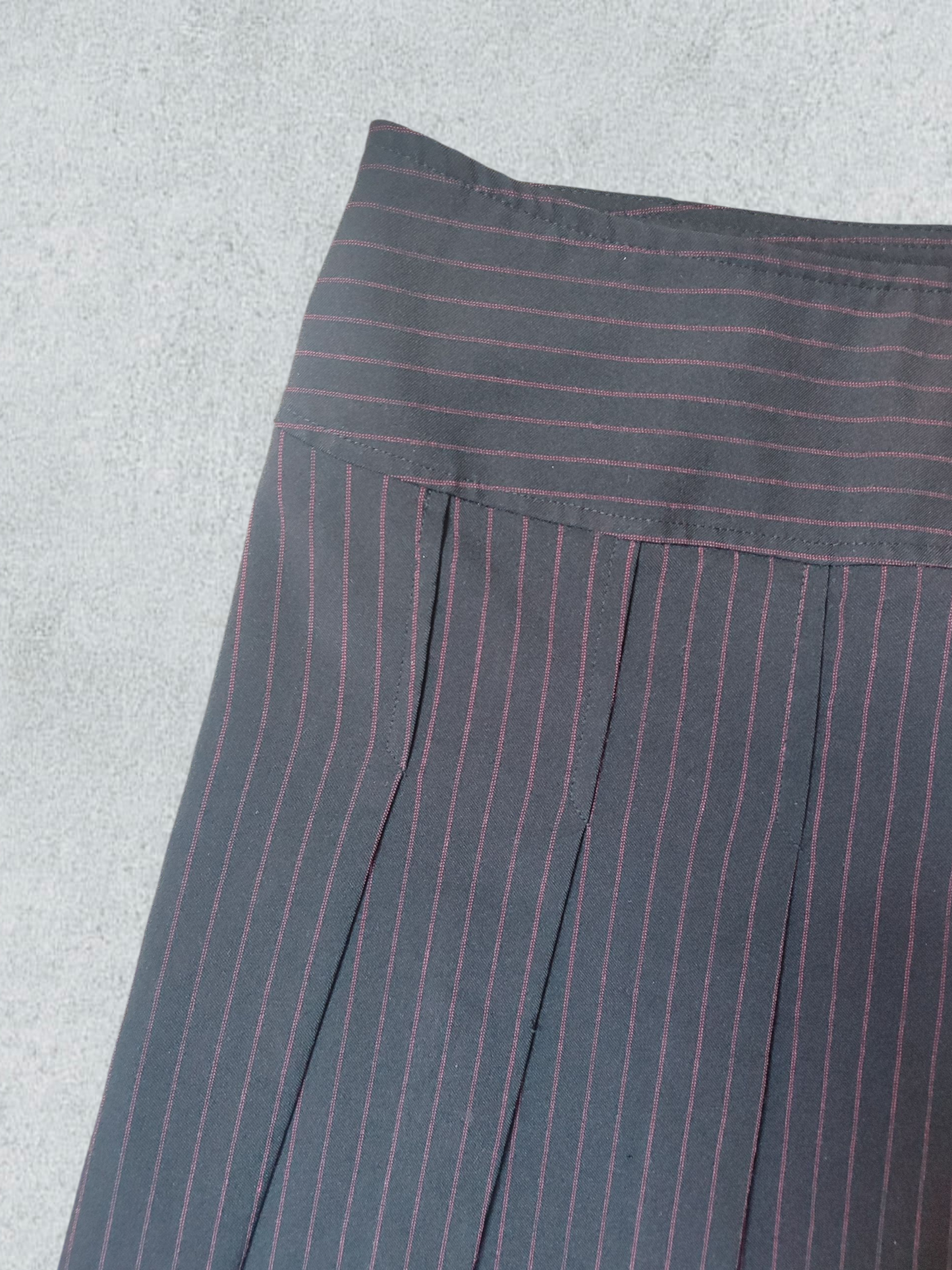 Black Pleated Mini Skirt With Red Pinstripes.