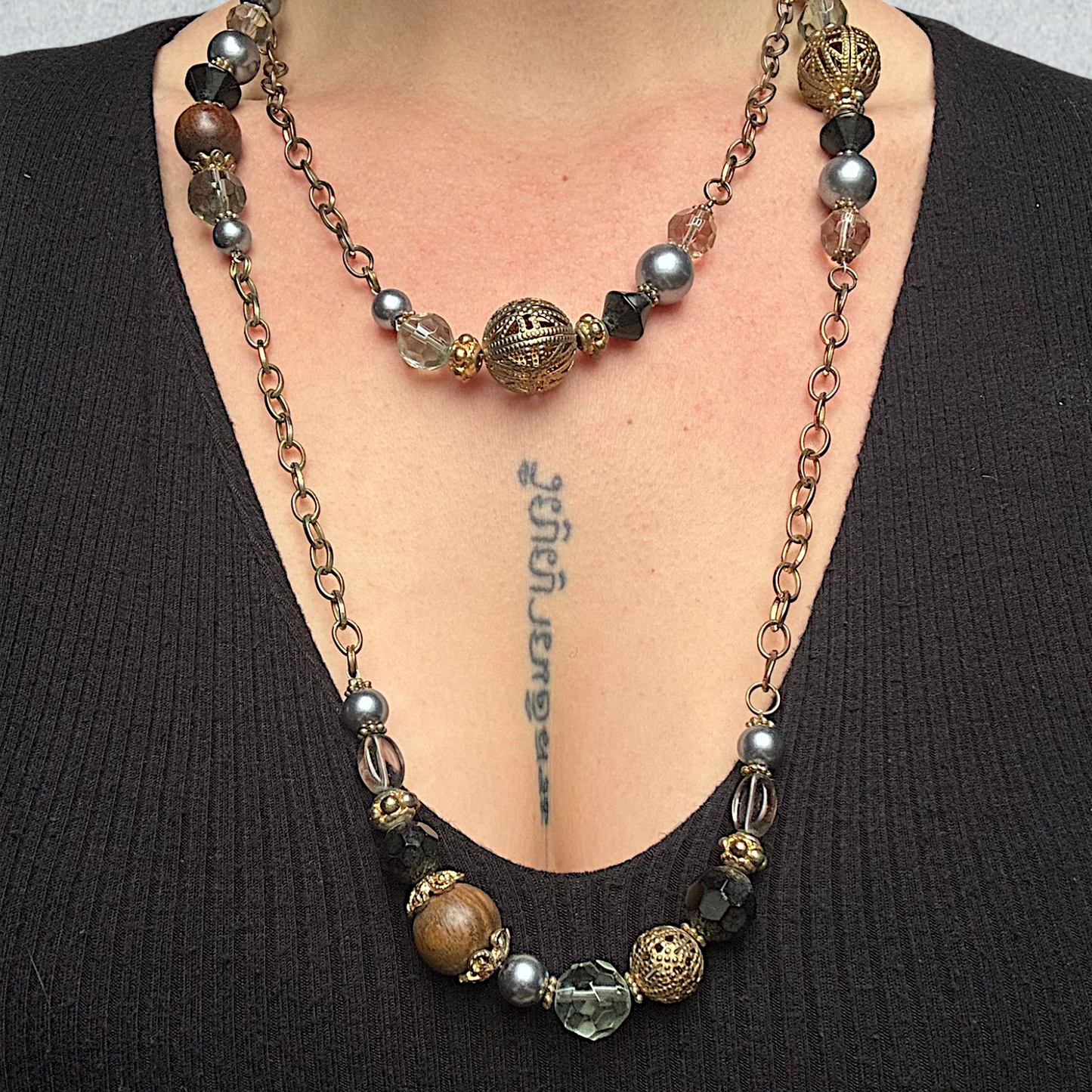 Long Beaded Necklace with Metallic and Crystal Accents